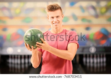Handsome young man at bowling club