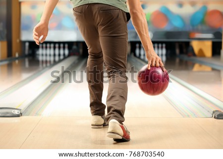 Young man at bowling club