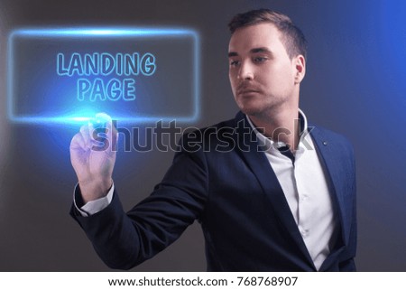 The concept of business, technology, the Internet and the network. Young businessman showing inscription: Landing page