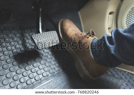 Close up Leather Shoe ob pedal in car Royalty-Free Stock Photo #768820246