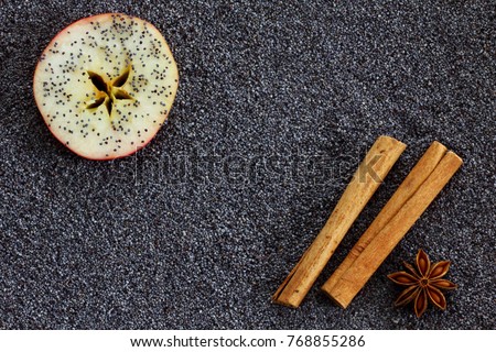 Poppy seed background with apple, cinnamon and star anise