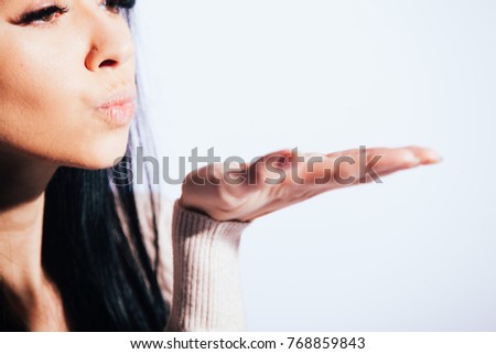 Pretty romantic young woman making a  gesture