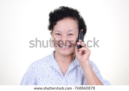 Asian Senior woman talking cellphone