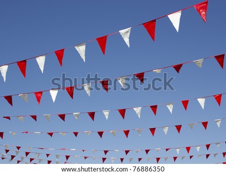 Small bunting hanging above a shopping mall