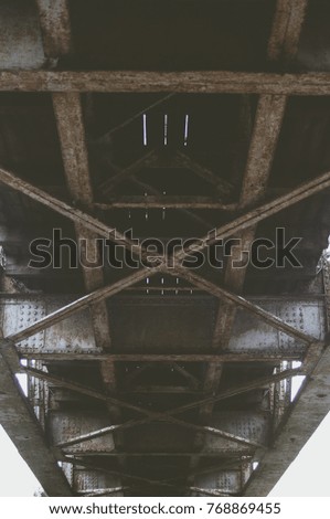 Railway bridge from the bottom.  Metal constructions.