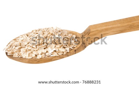 oatmeal cereals in wooden spoon isolated on white background