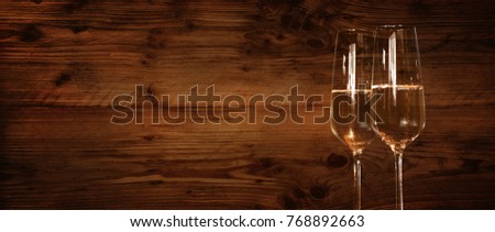 Rustic wooden wall with champagne glasses for congratulations