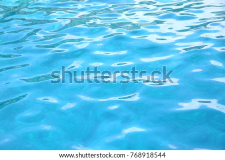 Close up of tropical water in the ocean or swimming pool, beautiful blue turquoise color with copy space, Caribbean.
