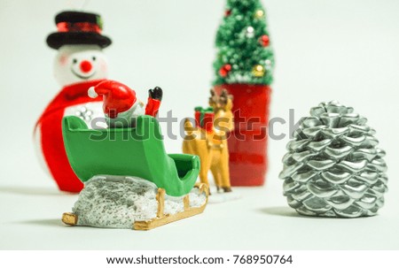 A snowman and the Christmas tree which meet Santa Claus.