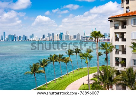 Panoramic view of Downtown Miami and Biscayne Bay with waterfront balconies.