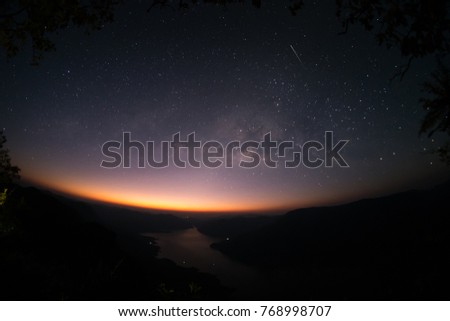 Mountains, rivers, stars and the Milky Way in the beautiful night sky.