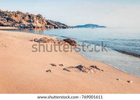 Sunny summer seascape of Aegean Sea. Beautiful marine landscape of Cuba Beach, Olimpiada village location, Greece, Europe. Beauty of nature concept background.