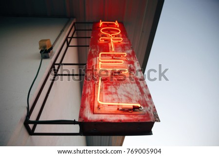 red neon hotel sign