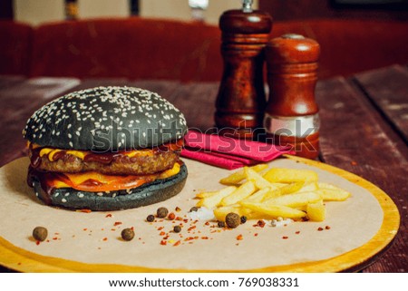 Burger with beef on wooden background with copy space