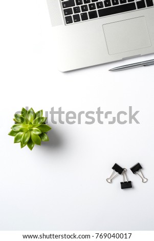 Modern laptop and business accessories on white background