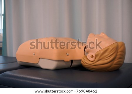 Mannequin for CPR on the table.