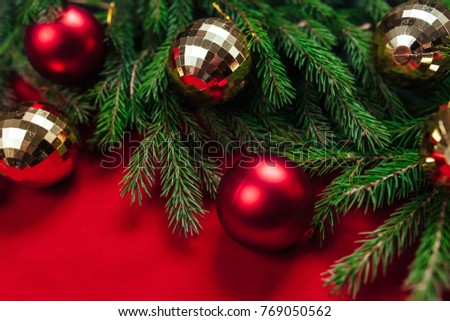 Christmas background. Balls of gold and red. Toys. The red background. Gold beads. Background for text