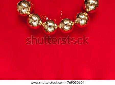 Christmas background. Balls of gold. Toys. The red background. Gold beads