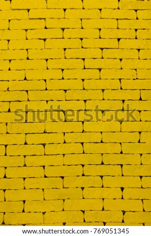 Yellow background, background picture, brick wall, for advertisement insert text A yellow wall. The yellow brick. Large brick wall