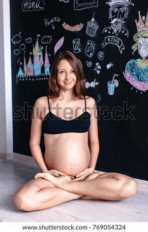 Healthy pregnant woman guessing about future gender  of her baby