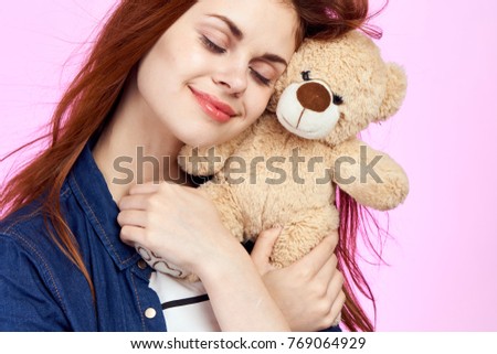  young woman with toy bears                              