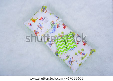 Children's mattress with a cushion for a lullaby