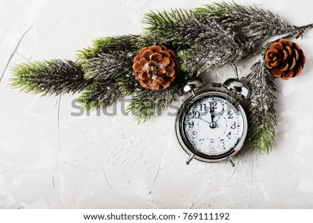 Christmas card with clock and winter decoration, top view with copy space