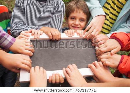 Hands holding advert board 