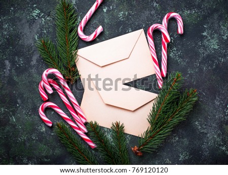 Christmas background with candy cane and letter. Top view