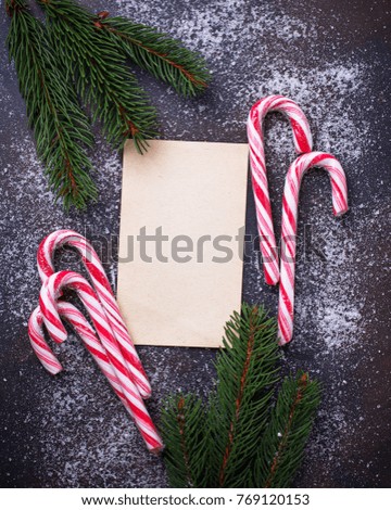 Christmas background with candy cane and letter. Top view