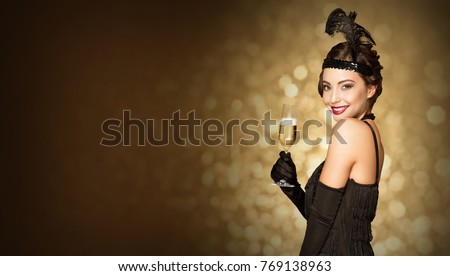 Portrait of 20s style festive beauty with glass of champagne.