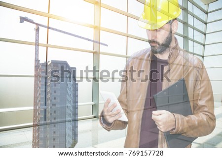 young architect or engineering builder in hard hat with tablet over group of builders at construction site, architect watching some a construction, business, building, industry, people concept 