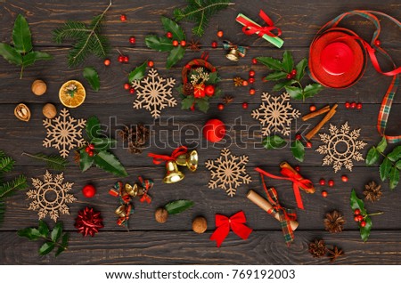 Creative diy hobby. Handmade tools for making modern christmas gift. Top view on wooden table with pine tree branches, craft accessories and scissors.