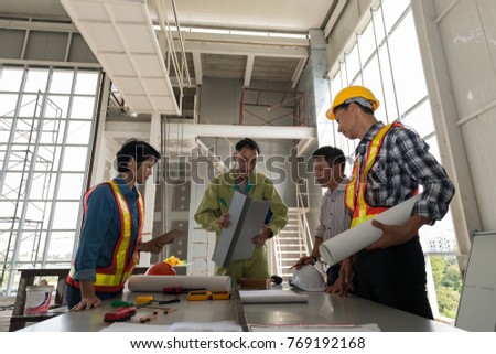Engineer group asia and worker meeting, discussion with construction on site work in friendly atmosphere joking and having fun during working process