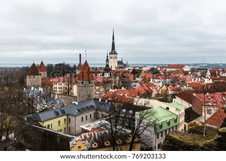 Aerial view of Tallinns old town on a cold cloudy Autumn afternoon, with the Baltic sea in the background.