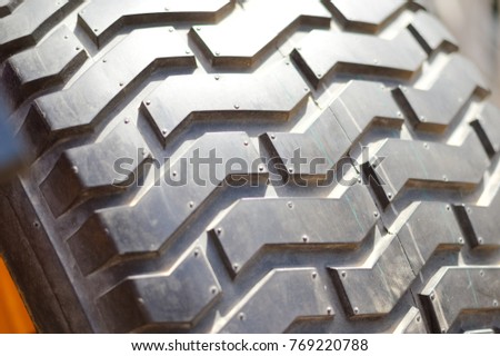 Close-up detail of car tires. Macro photography textured transportation pattern concept, abstract surface background