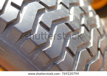 Close-up detail of car tires. Macro photography textured transportation pattern concept, abstract surface background