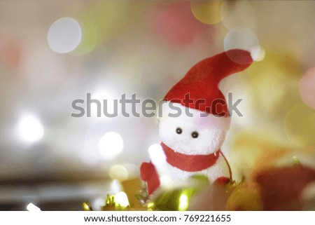 Bokeh of Christmas tree with lights Red Ribbon bow and Box for background abstract.Festive Gift of Happiness and the New Year 2018 celebrations.
