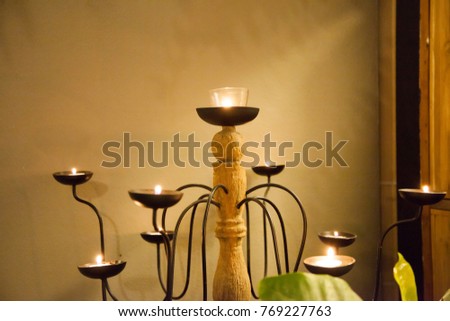 Light burning candles to set mood romantic Night time in scented candlelight
