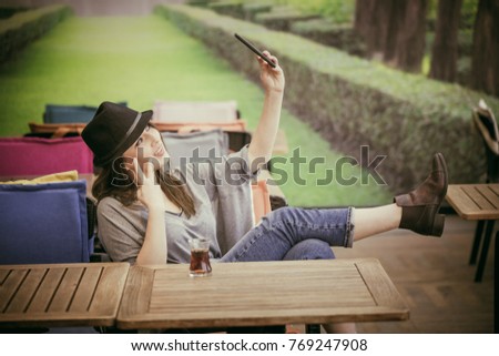 
happy girl doing selfie, beautiful girl drinking tea at the coffee shop