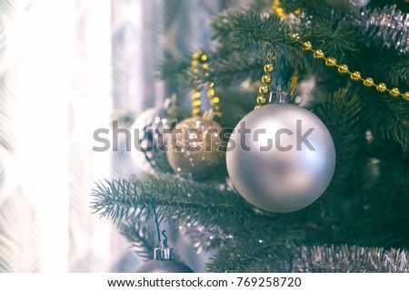 Christmas ornament ball decorate on pine tree copy space blur background for Xmas New Year festival.