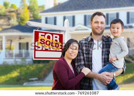 Mixed Race Chinese and Caucasian Parents and Child In Front of House and Sold For Sale Real Estate Sign.