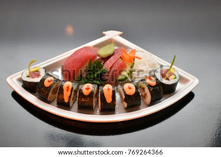 Sushi tuna set, white plate, dark background