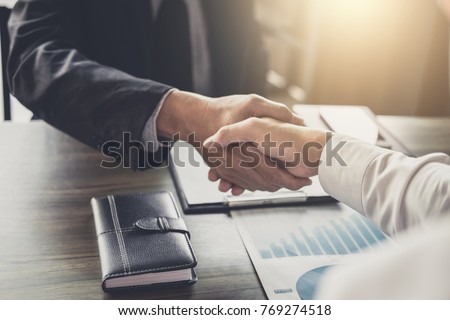Meeting and greeting concept, Two confident Business handshake and business people after discussing good deal of Trading contract and new projects for both companies, success, partnership, co worker. Royalty-Free Stock Photo #769274518