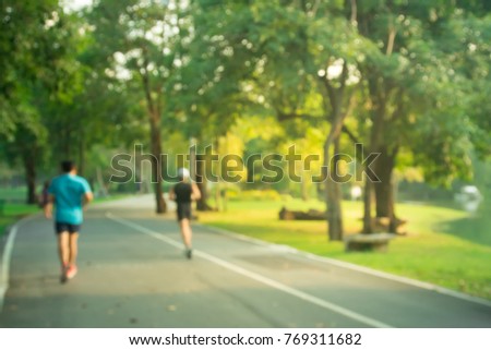 blurred backgrounds of people exercise and running at park outdoor