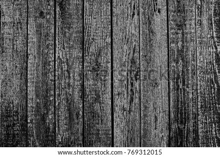 contrasting texture of the boards on a black background.