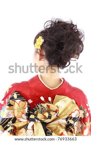 Young woman wearing Japanese kimono, isolated on white background.