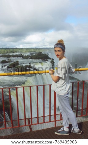 young woman near Iguazu Falls on Argentina and Brazil Borders