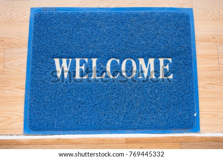 Welcome mat on the floor background
