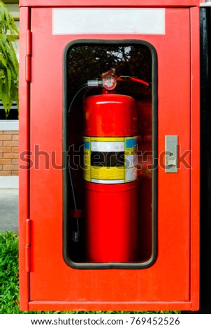 Fire extinguisher,Fire Extinguisher in red cabinet at exterior buildings.
